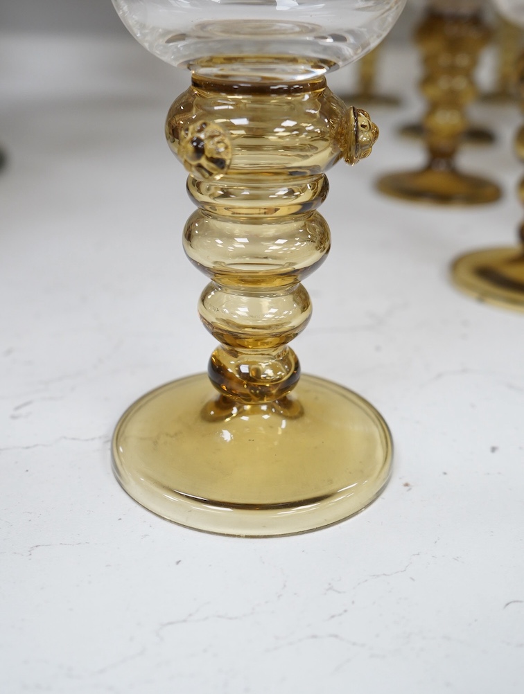 A collection of twenty three Dutch amber stemmed roemers, with etched bowls, largest each 19cm high. Condition - good